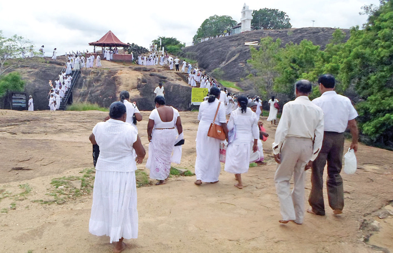 Pilgrims viewing the surroundings of the sacred site