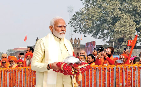 Indian Prime Minister Narendra Modi arrives for the opening of the temple on Jan. 22
