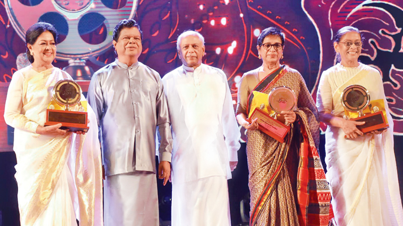 Actresses Malini Fonseka, Swarna Mallawarachchi and Anoja Weerasinghe who received felicitation awards with Prime Minister Dinesh Gunawardana  and Minister Dr. Bandula Gunawardena