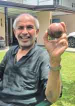 Bernand Wijetunga a collector of sports memorabilia with the historic ball