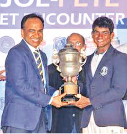 Abhishek Jayaweera of St. Joseph’s College, receiving the Best All-Rounder Trophy from Munesh David – Vice President, Group Supply Chain Management and Corporate Planning, Strategy, Dialog Axiata