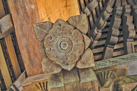  One of the carved floral designs on wooden beams on the roof