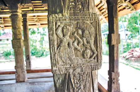 Finely carved wood carvings on one of the pillars