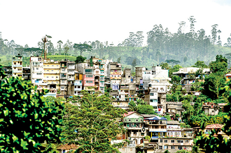 Box-shaped houses and shops across the hill-side new town of Maskeliya
