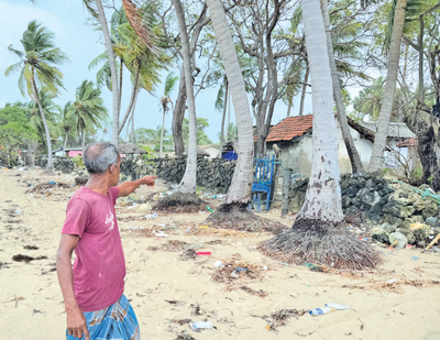 Damaged houses by sea waves
