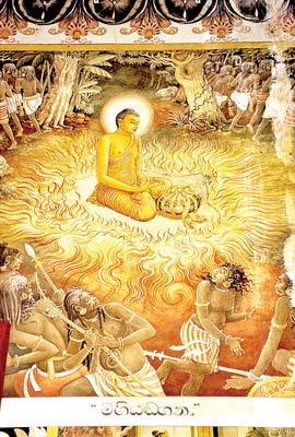 The wall painting at the Kelaniya Vihara shows the Buddha’s visit to Mahiyanganaya on the Duruthu full Moon Poya Day to settle a dispute between the Yakkas and Nagas (two tribes which inhabited the area)