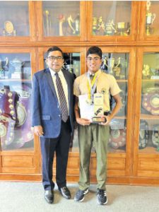 MuaazBary with AIS Principal Harshana Perera
