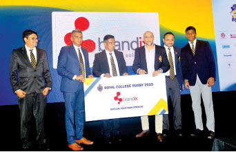 Royal Principal Athula Wijewardana (third from left) and Royal Match Organising Committee Chairman Dilshan de Silva (second from left) receiving the sponsorship package from Brandix Apparel Solutions Director Rajiv Malalasekera (third from right)Pix by Sudath Nishantha