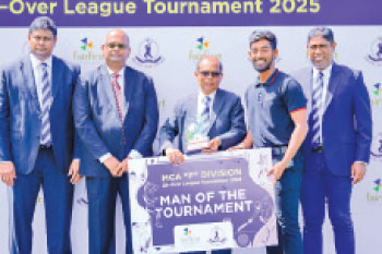 Chamath Chamupathi receiving theMan of the Tournament award from Rohan Somawansa, General Secretary MCA