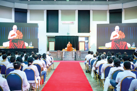 Ven. Ajahn Brahm delivering his Dhamma talk at the BMICH