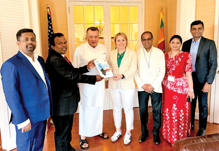President of America Sri Lanka Photographic Art Society, Los Angeles Suriya Perera presents the souvenir of the Beauty Of Sri Lanka photo Exhibition 2025 to Head of the delegation of European Union to the United States, Ambassador Jovita Neliupšien. Sri Lanka’s Ambassador to the USA Mahinda Samarasinghe to the USA is also in the picture.