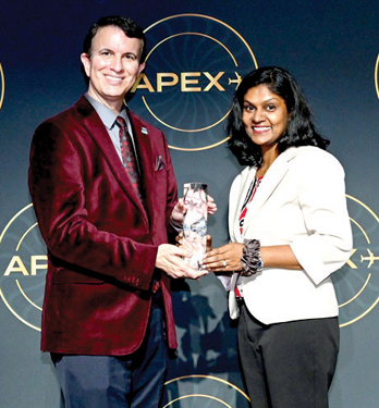 Maria Sathasivam, Manager Product Development of SriLankan Airlines, accepts the 2024 IFSA Best Inflight Food or Beverage Innovation Award from Dr. Joe Leader, Chief Executive Officer of APEX/IFSA, at the APEX/IFSA Awards in Long Beach, California.