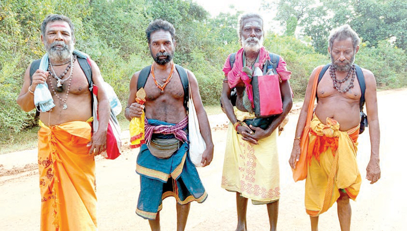 Devotees on foot through the Yala forest reserve