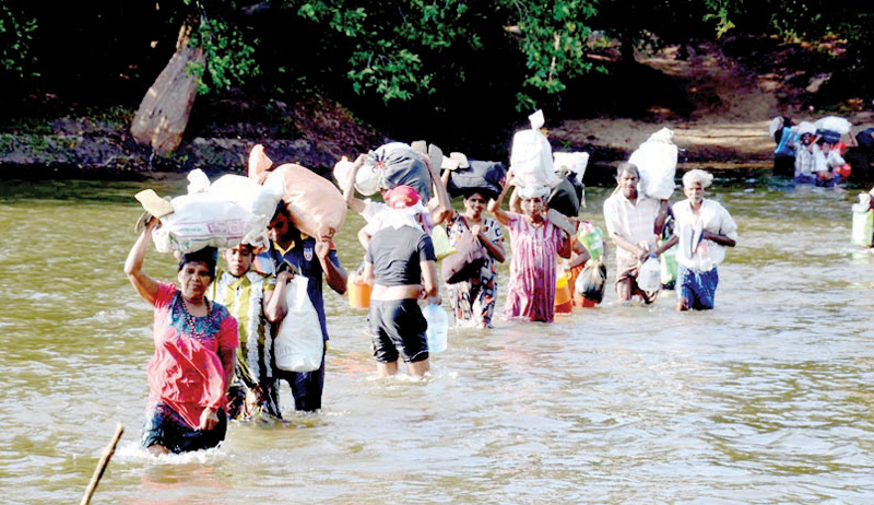 Pilgrims crossing the Manik River